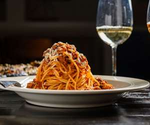 Greca Bolognese: traditional meat sauce with tomato, spices and mizithra cheese.