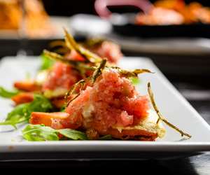 Tuna tartare on a crispy pita with Santorini fava and crispy kritamo.